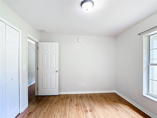 14939 SW 46th Cir, Ocala, FL 34473 - unfurnished bedroom with light wood-style flooring and a closet