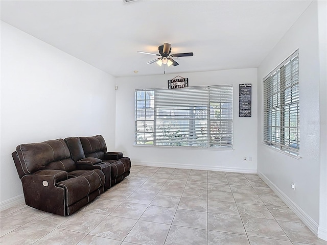 2460 The Oaks Blvd, Kissimmee, FL 34746 - living room with a ceiling fan, plenty of natural light, and light tile patterned floors
