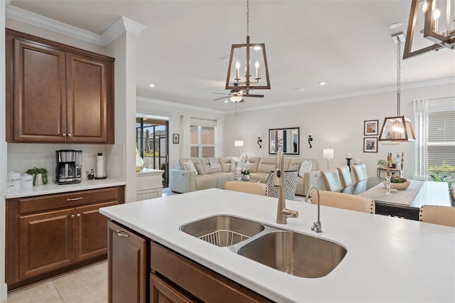 2338 Clemblue Rd, Clermont, FL 34715 - kitchen featuring hanging light fixtures, a ceiling fan, ornamental molding, recessed lighting, and backsplash
