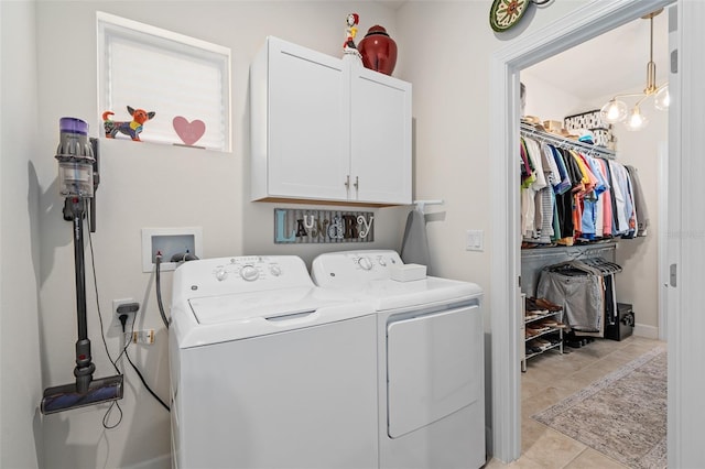 2338 Clemblue Rd, Clermont, FL 34715 - laundry area with cabinet space, independent washer and dryer, and light tile patterned floors