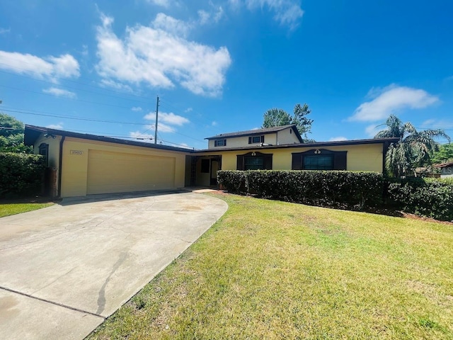 1980 Williams Manor Ave, Orlando, FL 32811 - traditional home featuring an attached garage, concrete driveway, and a front yard