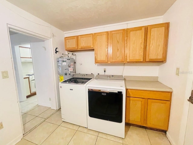 1980 Williams Manor Ave, Orlando, FL 32811 - washroom with cabinet space, independent washer and dryer, water heater, and light tile patterned floors