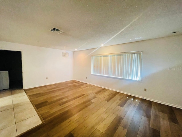 1980 Williams Manor Ave, Orlando, FL 32811 - unfurnished room featuring wood-type flooring and a textured ceiling