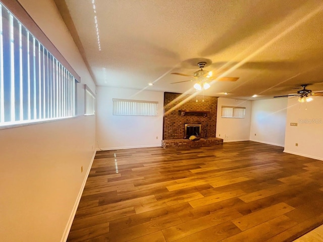 1980 Williams Manor Ave, Orlando, FL 32811 - unfurnished living room with ceiling fan, a textured ceiling, and wood finished floors