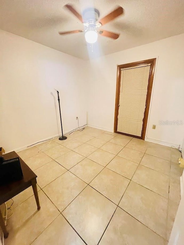 1980 Williams Manor Ave, Orlando, FL 32811 - spare room featuring ceiling fan, a textured ceiling, and light tile patterned flooring