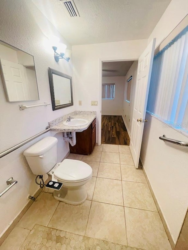 1980 Williams Manor Ave, Orlando, FL 32811 - half bath featuring tile patterned floors and a textured ceiling