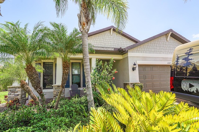 2647 Running Oak Ct, North Port, FL 34289 - view of front facade featuring a garage and stucco siding