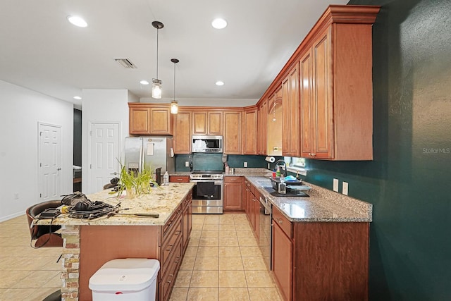 2647 Running Oak Ct, North Port, FL 34289 - kitchen with appliances with stainless steel finishes, light tile patterned floors, light stone counters, and recessed lighting