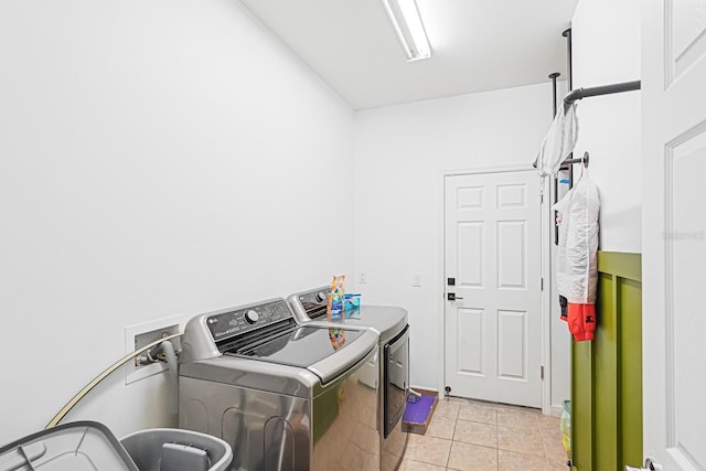 2647 Running Oak Ct, North Port, FL 34289 - washroom featuring separate washer and dryer and light tile patterned floors