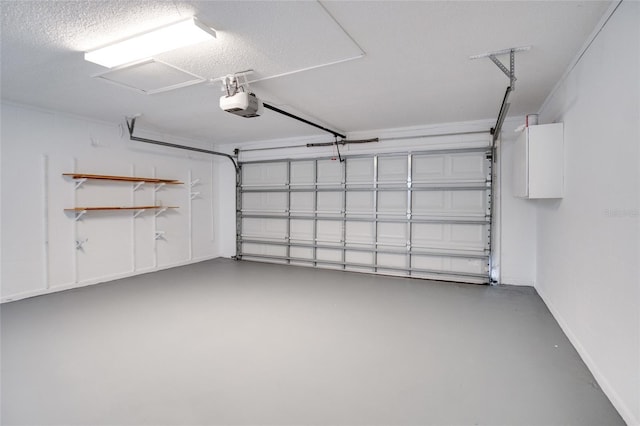 2262 Stonehedge Loop, Kissimmee, FL 34743 - garage with a garage door opener and baseboards
