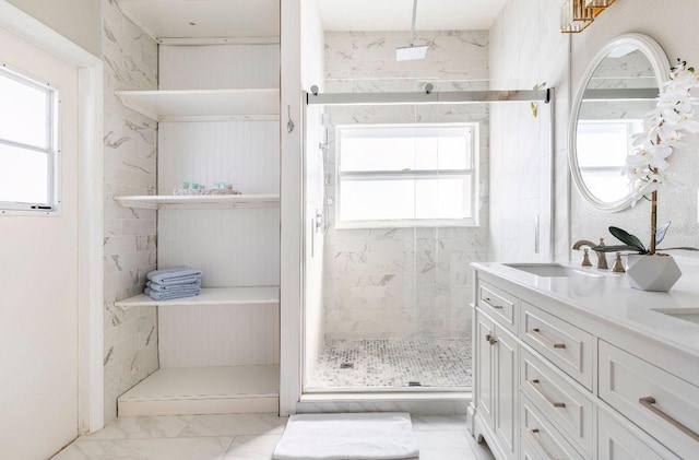 1041 Jaybee Ave, Davenport, FL 33897 - full bathroom with marble look tiles, a shower stall, and double vanity