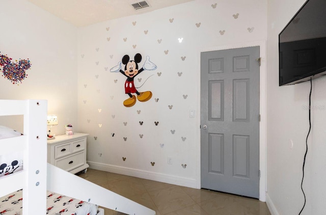 1041 Jaybee Ave, Davenport, FL 33897 - unfurnished bedroom featuring baseboards and light tile patterned flooring