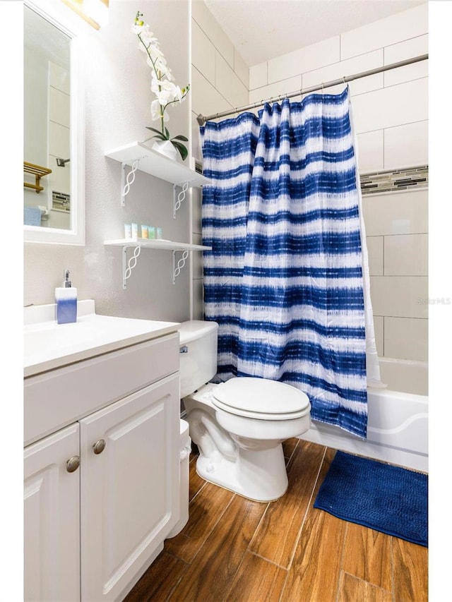 1041 Jaybee Ave, Davenport, FL 33897 - full bathroom featuring vanity, shower / tub combo, and wood finished floors