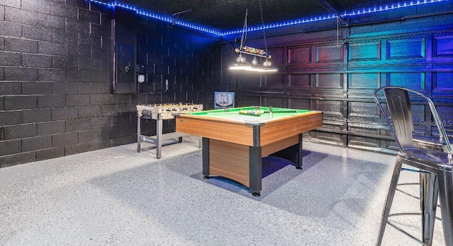 1041 Jaybee Ave, Davenport, FL 33897 - recreation room featuring pool table, concrete block wall, and speckled floor