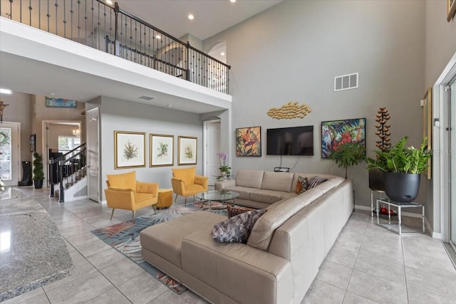 15264 Shonan Gold Dr, Winter Garden, FL 34787 - tiled living area featuring a high ceiling and stairway