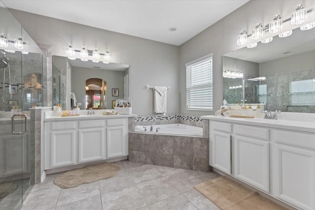 15264 Shonan Gold Dr, Winter Garden, FL 34787 - full bath with two vanities, a shower stall, a bath, and tile patterned flooring