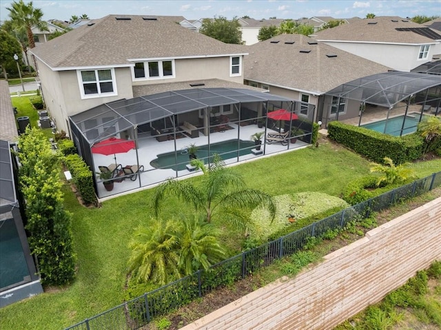 15264 Shonan Gold Dr, Winter Garden, FL 34787 - rear view of house featuring a shingled roof, stucco siding, a patio, and a fenced backyard