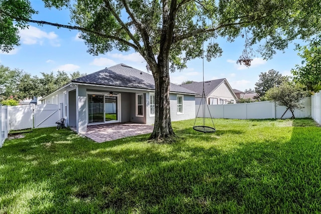 6539 Chagford Ln, Windermere, FL 34786 - rear view of property featuring a gate, stucco siding, a fenced backyard, a patio, and ceiling fan