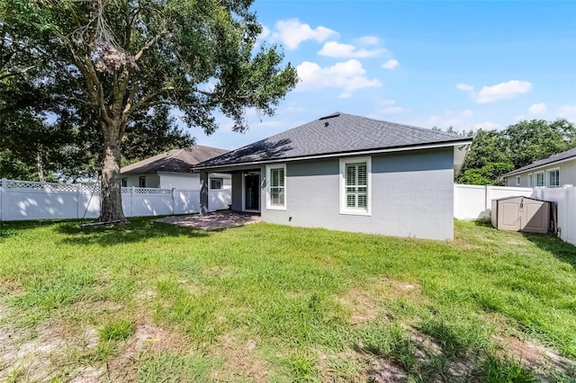6539 Chagford Ln, Windermere, FL 34786 - back of house with stucco siding, a fenced backyard, and a shingled roof