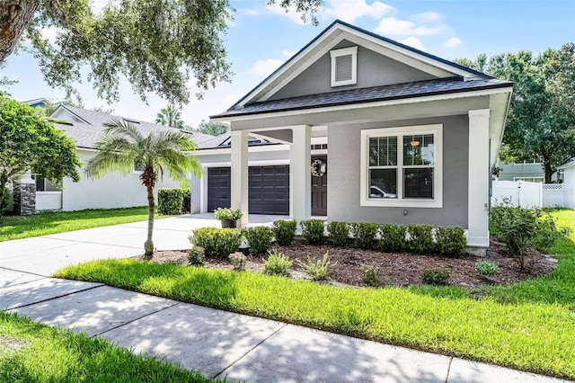 6539 Chagford Ln, Windermere, FL 34786 - view of front of home featuring concrete driveway, an attached garage, and stucco siding