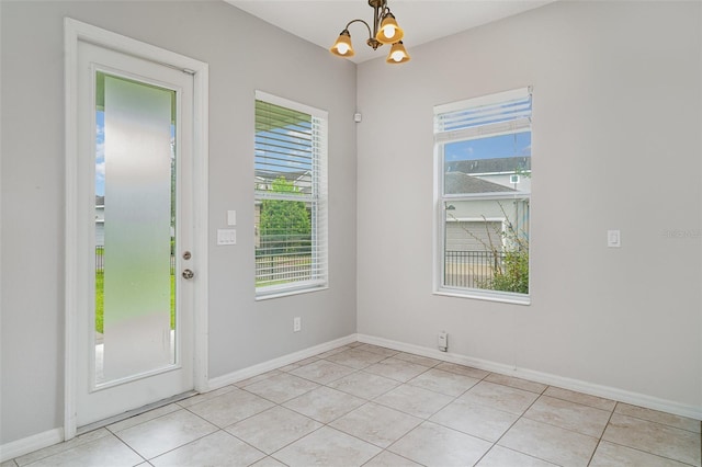 11307 Grand Park Ave, Riverview, FL 33578 - unfurnished room featuring a chandelier and light tile patterned floors