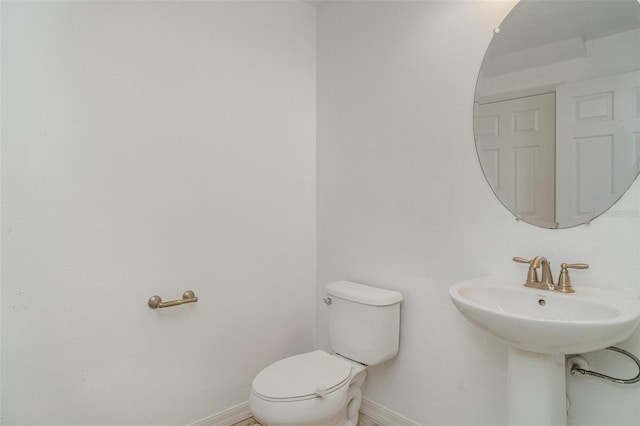 11307 Grand Park Ave, Riverview, FL 33578 - bathroom featuring toilet and baseboards