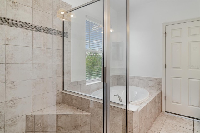 11307 Grand Park Ave, Riverview, FL 33578 - bathroom featuring a garden tub, a tile shower, and tile patterned floors