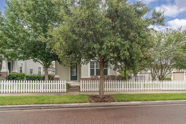 11307 Grand Park Ave, Riverview, FL 33578 - view of property hidden behind natural elements featuring stucco siding