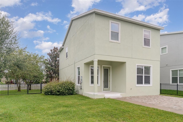 11307 Grand Park Ave, Riverview, FL 33578 - rear view of property with stucco siding and a patio area