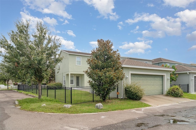 11307 Grand Park Ave, Riverview, FL 33578 - view of front of property with stucco siding, a garage, and driveway