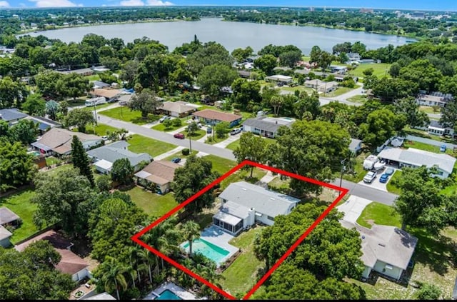 904 15th St NE, Winter Haven, FL 33881 - aerial perspective of suburban area featuring property parcel outlined and a nearby body of water
