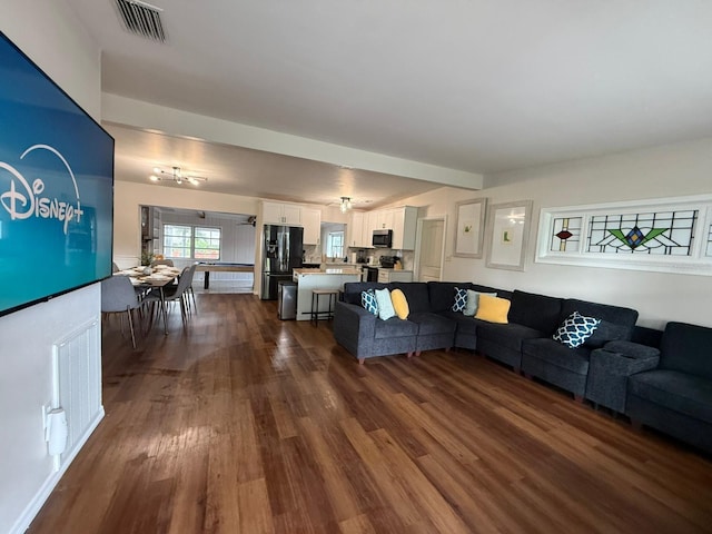 904 15th St NE, Winter Haven, FL 33881 - living room featuring dark wood-type flooring