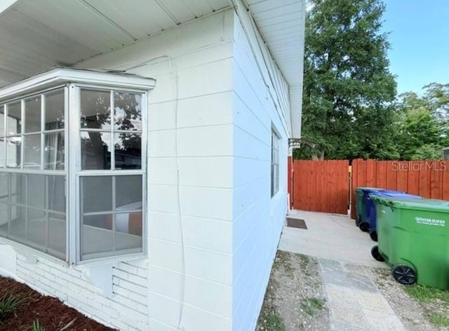 904 15th St NE, Winter Haven, FL 33881 - view of home's exterior with a sunroom