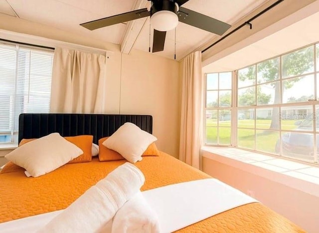 904 15th St NE, Winter Haven, FL 33881 - bedroom featuring a ceiling fan and beamed ceiling