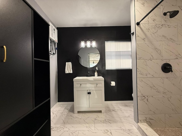 904 15th St NE, Winter Haven, FL 33881 - bathroom with marble finish flooring, vanity, and a tile shower