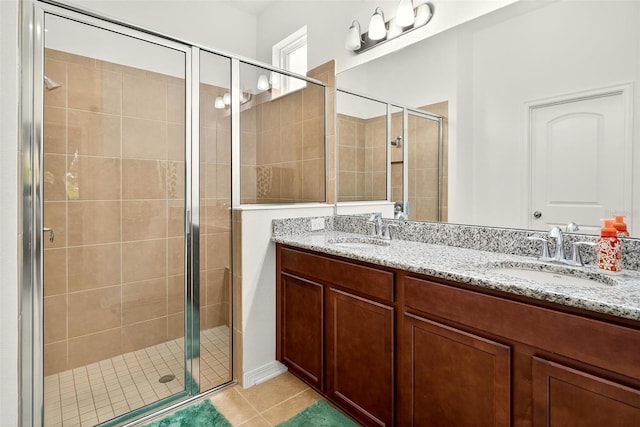 1559 Bayfront Park Aly, Winter Garden, FL 34787 - bathroom featuring a stall shower, double vanity, and tile patterned floors
