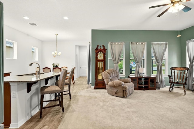 1559 Bayfront Park Aly, Winter Garden, FL 34787 - living room featuring ceiling fan, a chandelier, and recessed lighting