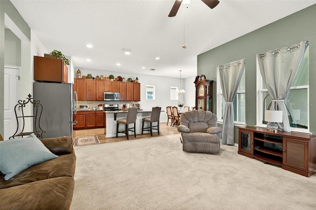 1559 Bayfront Park Aly, Winter Garden, FL 34787 - living area with a ceiling fan, light carpet, a chandelier, and recessed lighting