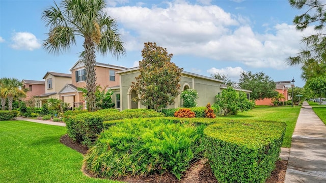 1559 Bayfront Park Aly, Winter Garden, FL 34787 - view of front facade featuring a front yard and stucco siding
