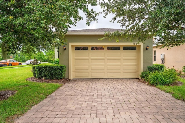 1559 Bayfront Park Aly, Winter Garden, FL 34787 - garage with decorative driveway