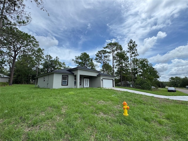 2011 W Tacoma Dr, Citrus Springs, FL 34434 - prairie-style house with driveway, an attached garage, stucco siding, and a front lawn