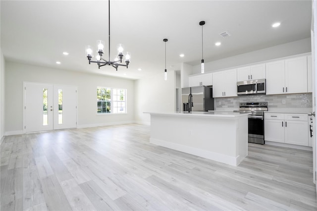 2011 W Tacoma Dr, Citrus Springs, FL 34434 - kitchen with stainless steel appliances, a chandelier, open floor plan, tasteful backsplash, and recessed lighting