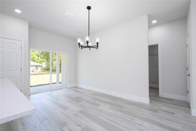 2011 W Tacoma Dr, Citrus Springs, FL 34434 - unfurnished dining area with a chandelier, light wood finished floors, and recessed lighting
