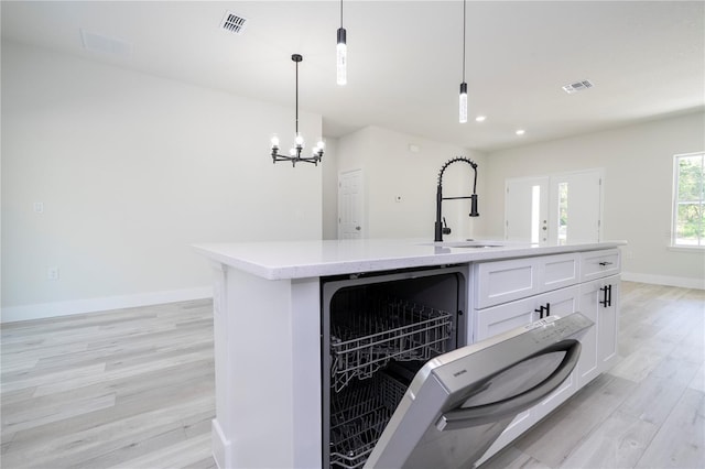 2011 W Tacoma Dr, Citrus Springs, FL 34434 - kitchen featuring light wood-type flooring, white cabinets, decorative light fixtures, an island with sink, and recessed lighting