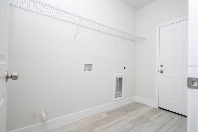 2011 W Tacoma Dr, Citrus Springs, FL 34434 - laundry room with light wood finished floors, hookup for a washing machine, and electric dryer hookup