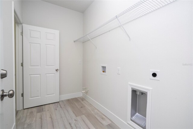 2011 W Tacoma Dr, Citrus Springs, FL 34434 - laundry room featuring hookup for a washing machine, electric dryer hookup, and light wood-style flooring