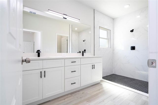 2011 W Tacoma Dr, Citrus Springs, FL 34434 - full bathroom with a marble finish shower, double vanity, and wood finished floors
