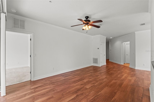 8362 Bella Tierra Ct Unit 10146, Davenport, FL 33896 - empty room with ceiling fan, wood finished floors, and ornamental molding