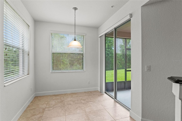 8362 Bella Tierra Ct Unit 10146, Davenport, FL 33896 - unfurnished dining area featuring a textured wall and light tile patterned flooring