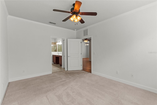 8362 Bella Tierra Ct Unit 10146, Davenport, FL 33896 - unfurnished bedroom with ornamental molding, light carpet, connected bathroom, and ceiling fan